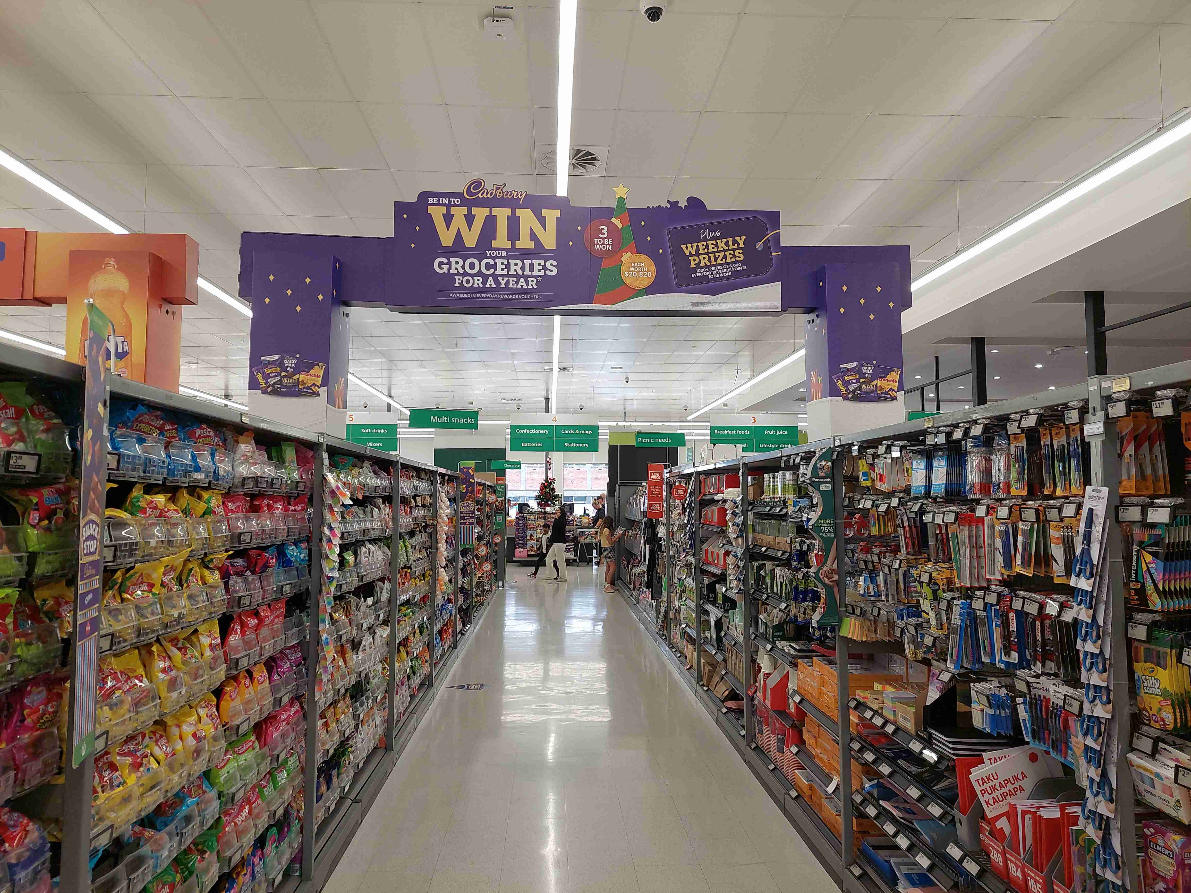 confectionary aisle in supermarket with Cadbury branding